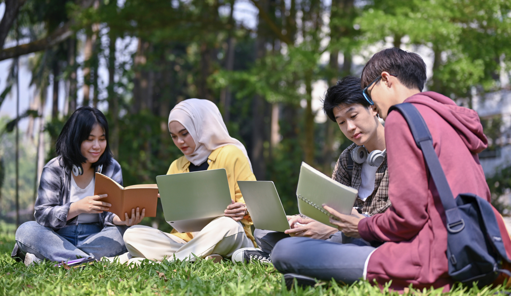 Students in a park studying.